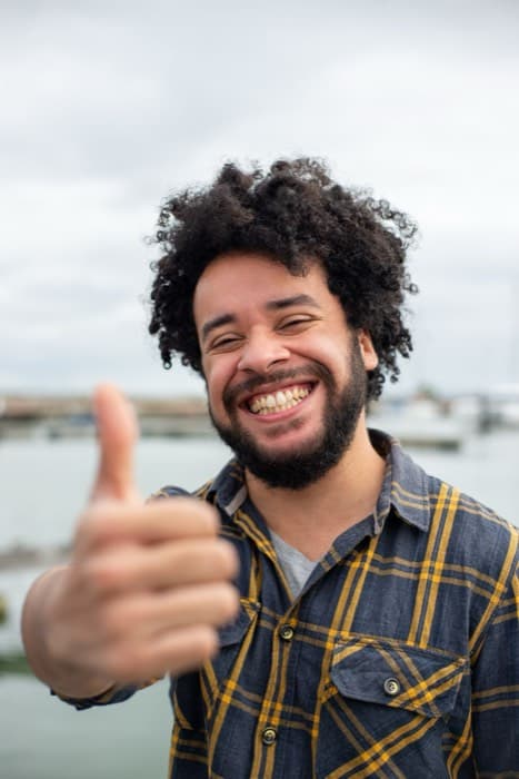 A happy business owner whose website, apps, automation and marketing are all handled